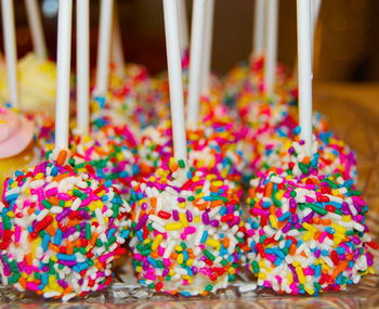 Close-up of colorful sprinkles on cake pops at store