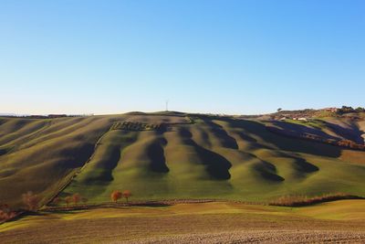 Scenic view of desert against clear sky