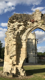Old ruins of temple against cloudy sky