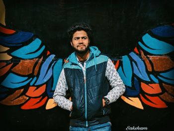 Portrait of young man standing outdoors