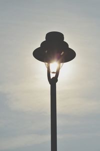 Low angle view of street light against sky