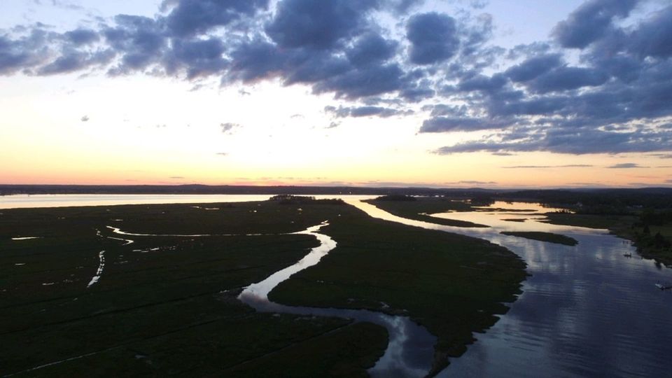 SCENIC VIEW OF SEA AGAINST SUNSET SKY