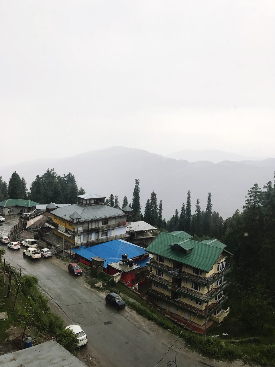 copy space, high angle view, architecture, building exterior, water, built structure, mountain, clear sky, outdoors, day, tree, sky, transportation, nature, no people, nautical vessel