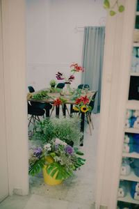 Flowers in vase on window sill