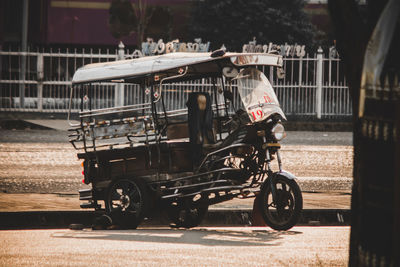 Side view of people on street in city