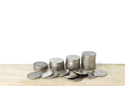 Close-up of stack of objects over white background