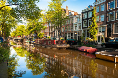 Canal amidst buildings in city