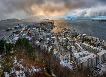 View over Ålesund from aksla mountain during an incoming snowstorm, norway.