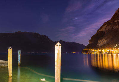 Scenic view of lake against sky at night