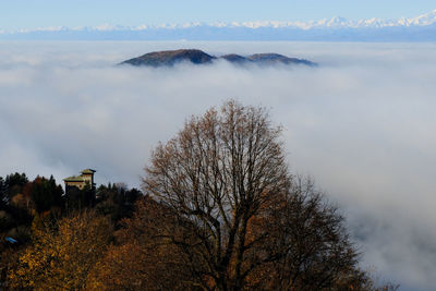 A sea of fog over the city of como and lake como, from a panoramic viewpoint in brunate.