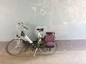 Bicycle leaning against wall