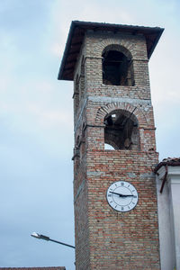 Low angle view of clock tower against sky