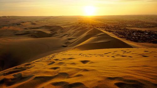 Aerial view of desert during sunset