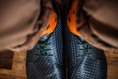 Close-up of man wearing shoes