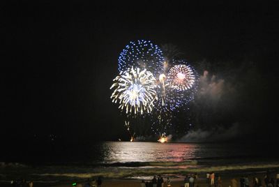 Fireworks exploding at night