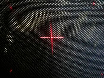 Full frame shot of illuminated metal grate