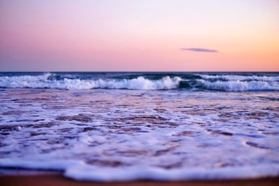 Scenic view of sea against sky at sunset