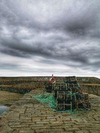 Lifeguard hut on land against sky