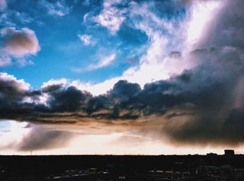 Scenic view of landscape against cloudy sky