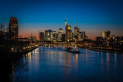 Illuminated city at waterfront