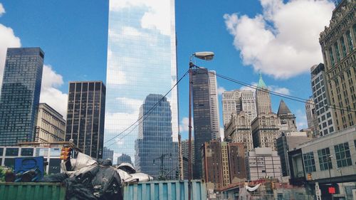 Low angle view of skyscrapers against sky