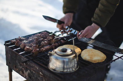 Close-up of preparing meat holding meat