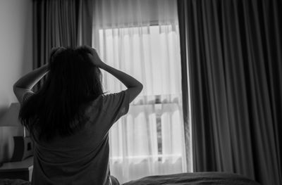 Selective focus on stressed and depressed woman pulling hair. nervous person. mental health.