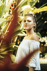 Portrait of young woman standing outdoors