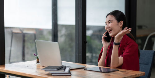 Businesswoman working at desk in office