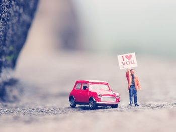 Close-up of toy car on road