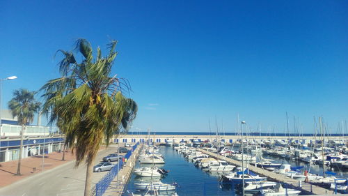 Harbor against clear blue sky