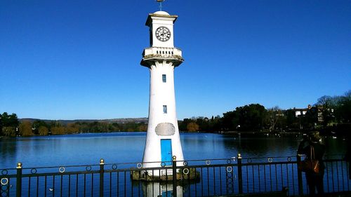 View of lighthouse against clear blue sky