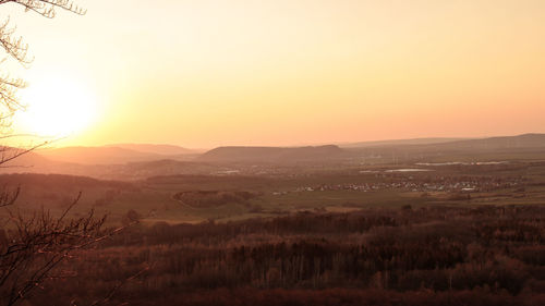 Scenic view of landscape against sky during sunset