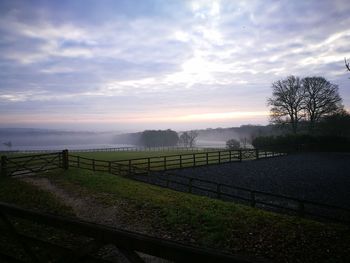 Scenic view of field against sky during sunset