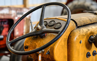 Vintage farm tractor steering wheel and gauges