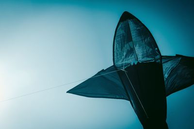 Low angle view of kite flying against clear sky