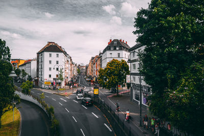 Vehicles on road against buildings in cologne 