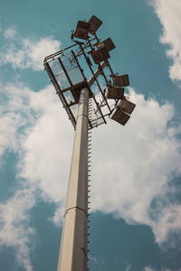 Low angle view of floodlight against sky