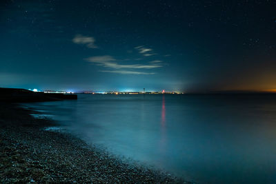 Scenic view of sea against sky at night