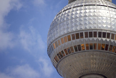 Low angle view of building against cloudy sky