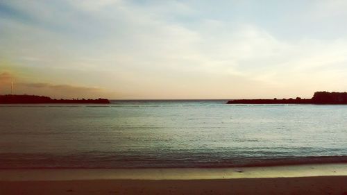 Scenic view of sea at sunset