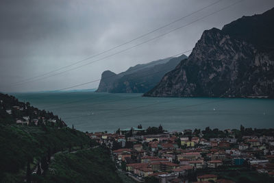 Scenic view of sea and buildings against sky