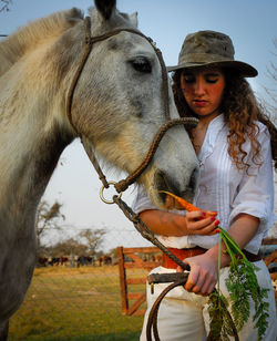 Young woman with horse