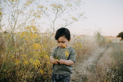 Full length of child standing on field