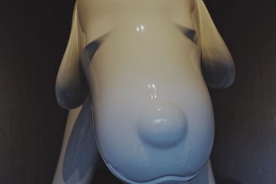 High angle view of mannequin against black background