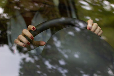 Close-up of woman hand holding plant