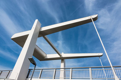 Low angle view of windmill against sky