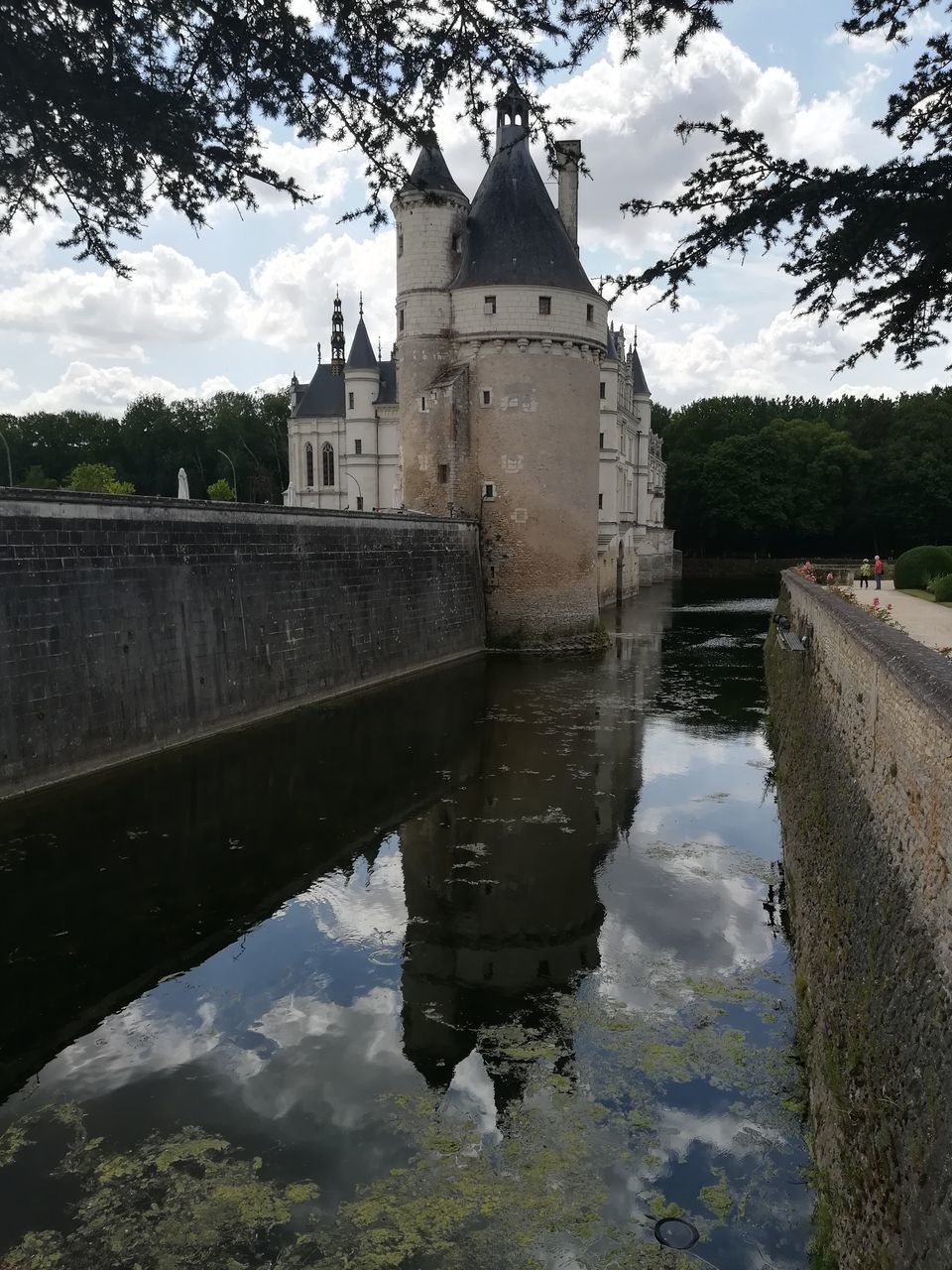 REFLECTION OF BUILDING ON RIVER