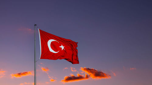 Low angle view of flag against sky