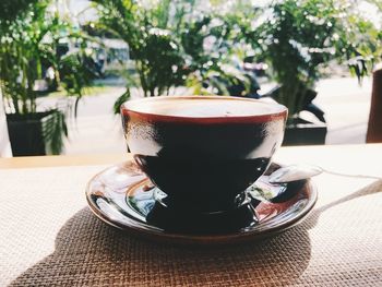 Close-up of coffee cup on table